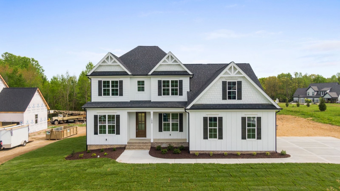 New two-story home with a landscaped yard