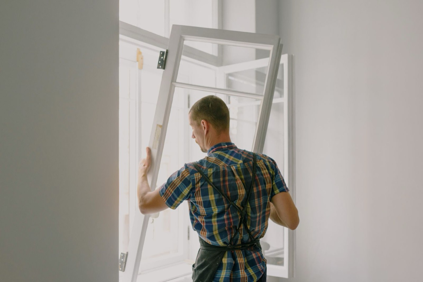 Installer fitting a new window
